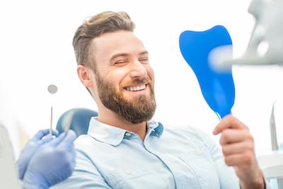 zirconia dental implants lake oswego | man after getting dental implants