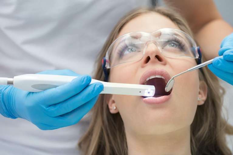 patient at routine preventive dental care visit for saliva testing