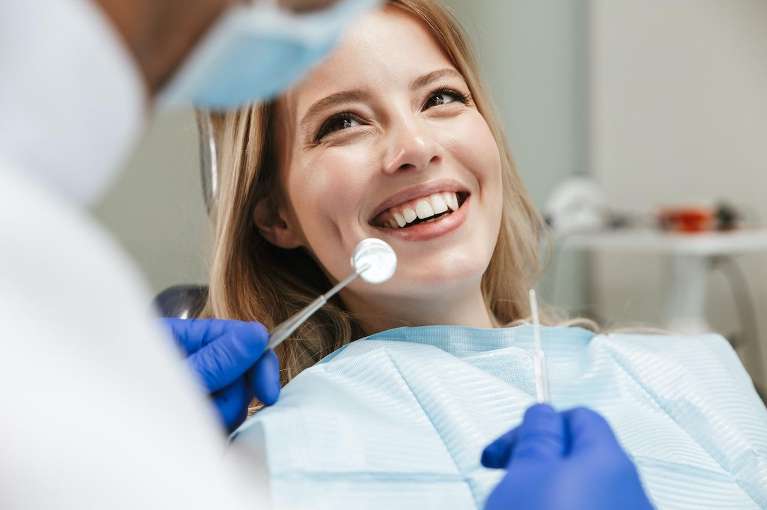 holistic dentist lake oswego | woman at dentist