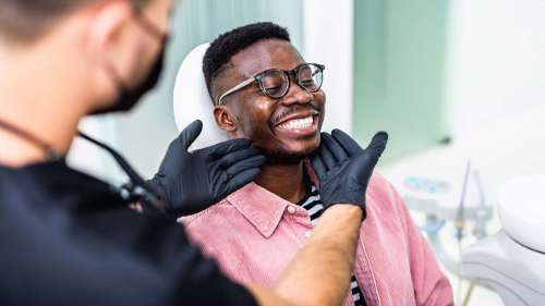 patient discussing holistic tooth replacement with dentist in lake oswego